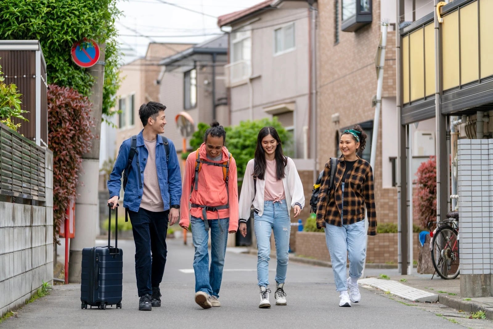 People crossing a lively Tokyo street